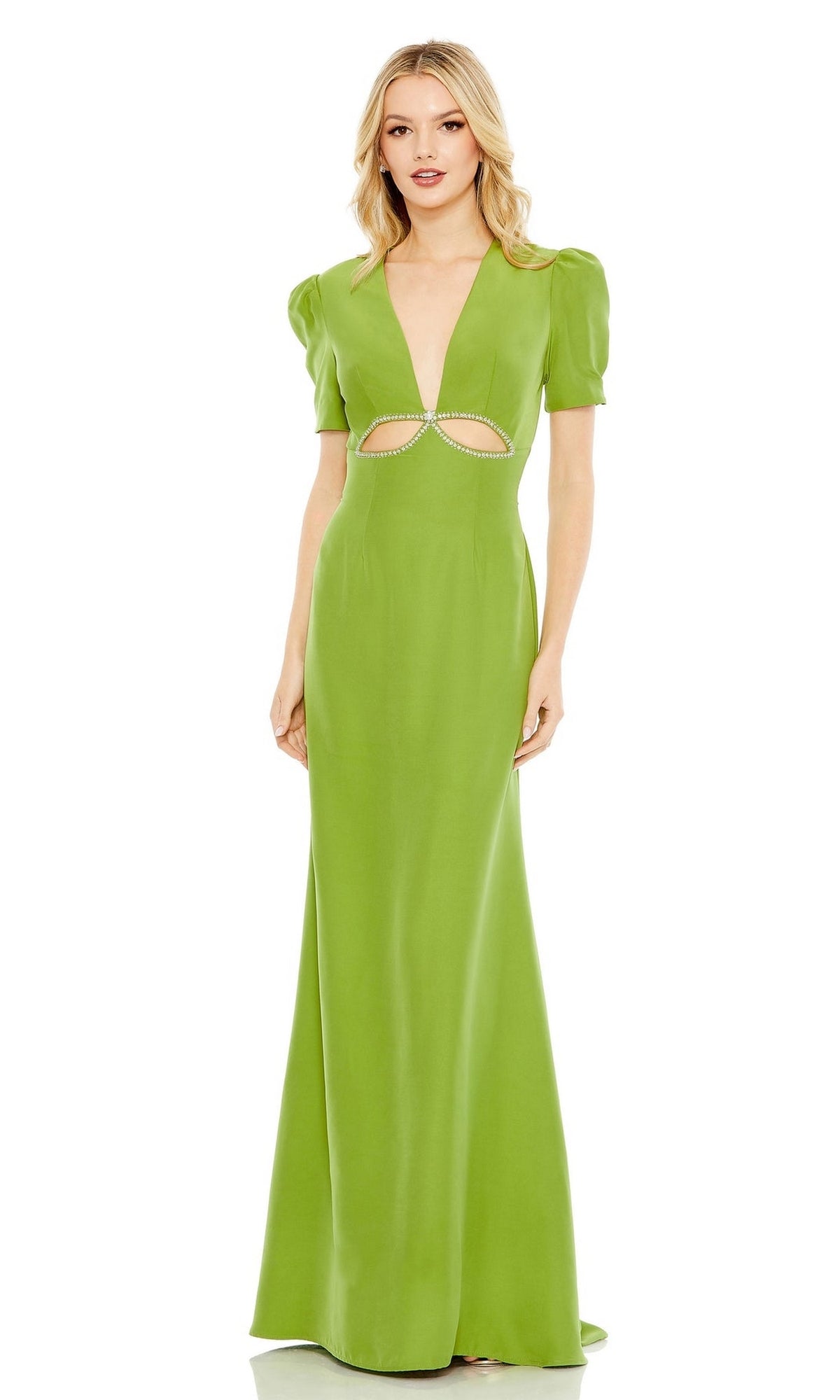 A woman wears the Mac Duggal 2630: a long, bright green formal dress with short sleeves, a deep V-neckline, and a cutout below the bust adorned with small embellishments.